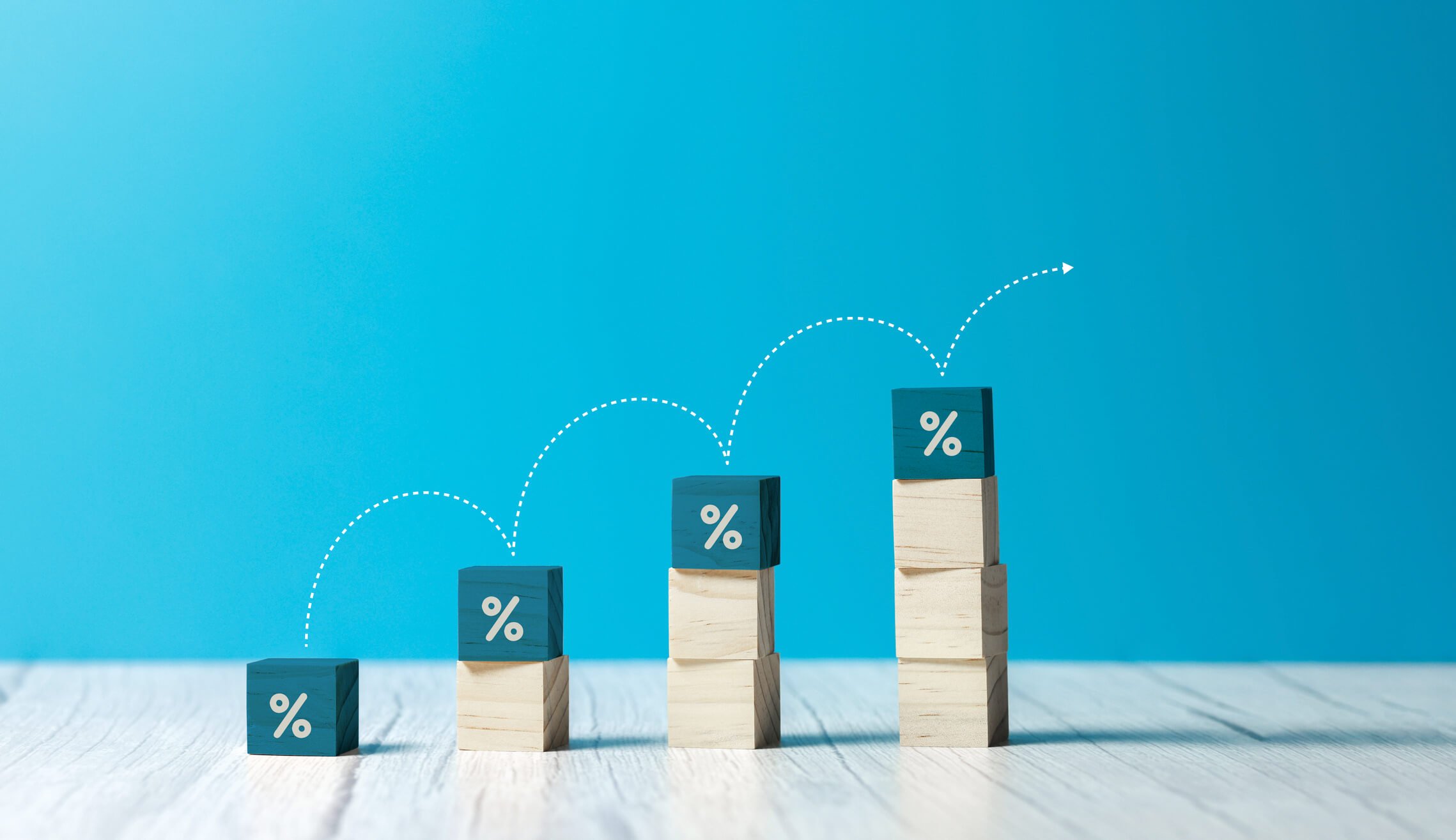 building blocks showing inflation percentage increase on a blue background