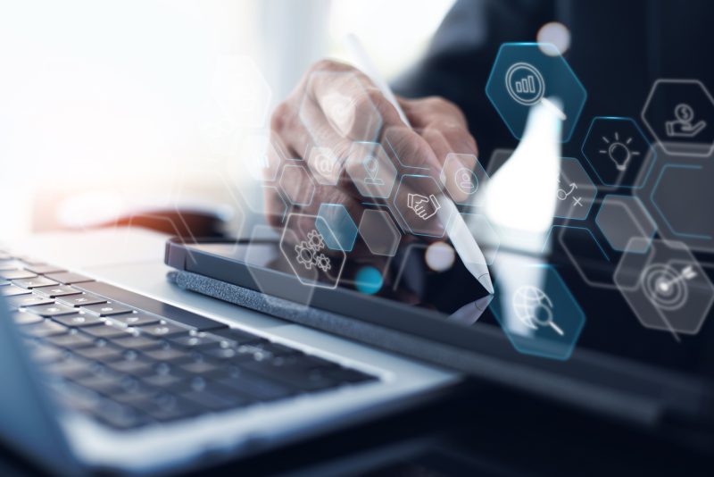 digital icons overlaid on laptop to represent intelligent technology