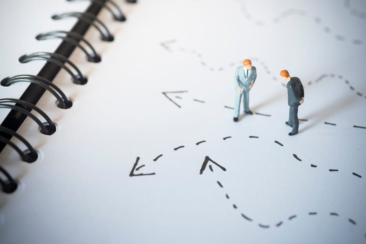 concept image of two businessmen assessing different options